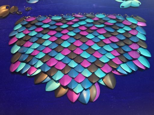 A black, blue, and purple panel of scalemail.